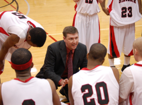 Head Coach Jeff Price talks to his team during a time-out against Souter State Community College on Dec. 8. As of Jan. 9, the Pride's winning streak reached eight games --photo by Joe Stueve