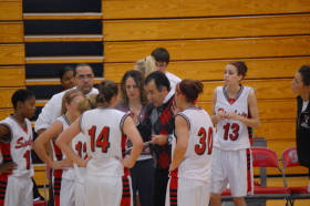Coach Jeff Dillon goes over the game plan with the Lady Pride. "They have [played] with a lot of grit," said Dillon. --photo by Joeseph Stueve