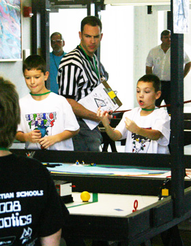 Members f the Tippecanoe (Tipp City) Tornadoes FFL team cheer their robot during the robotics challenge --photo by Dennis Hitzeman