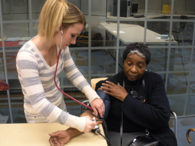 Nursing student, Misty Mitchell, takes Mary Pruitt's blood pressure. "It's preventative health care. People need to know what their blood pressure is so they can seek treatment because the earlier, [the better]," said Mitchell.