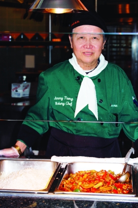 Jimmy Treng serves as wokery chef in the Tartan Marketplace. The Marketplac is one of several dining options on campus and is located in the basement of Building 7. --photo by Mary Edwards