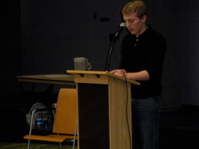 Sinclair student, Christian Schlorman reads "Grandfather" by Michael S. Harper