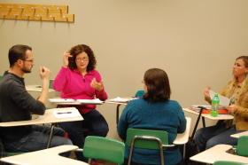 Ron Hinrichesen (left) and Josie Greco (next left) practice sign language during their ALS 212 "Specialized Interpreting" class on April 8. --photo by Rusty Pate