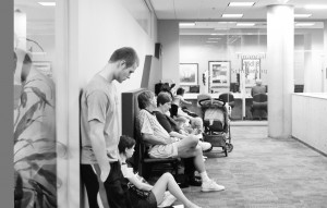 Freshman Brandon Napier stands at the end of a long line of students waiting to speak with a financial aid counselor in Building 10.