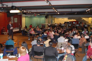 Professor Mohsen Khani speaks to the crowd about Iran in Building 8 on Oct. 14, 2009.