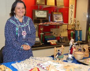 Debbie McBride stands with some of her sewing and beaded work at the First Nations Festival on Nov. 10. “If we could find another advisor, we’d do (the festival) again,” she said.  “If we could find more members, that would be key.”