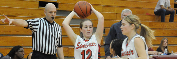 A group of women playing basketball
