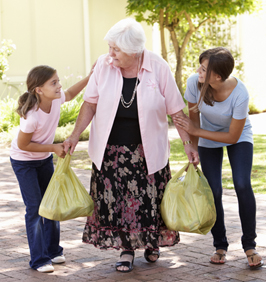 iStock_Helping Elderly Woman with Groceries.jpg
