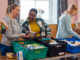 Image of people sorting canned food.